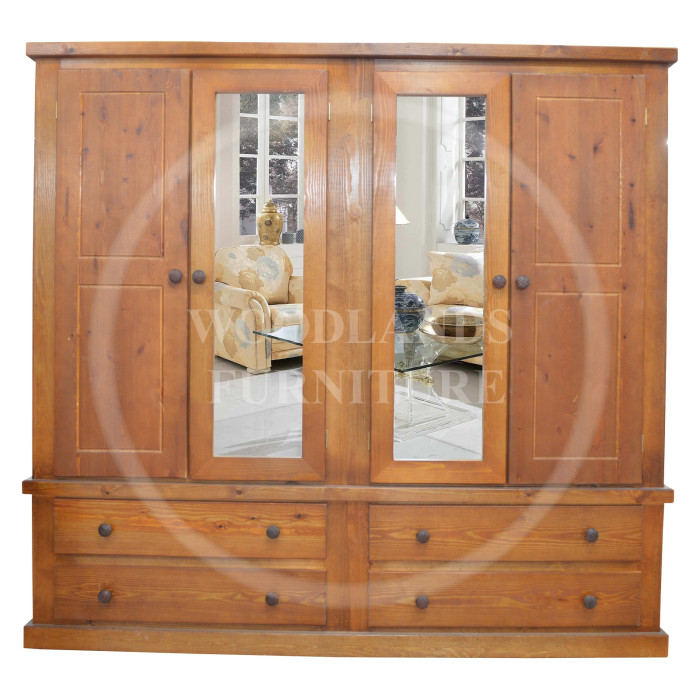 DEWSBURY SOLID PINE QUAD 4 DOOR 4 DRAWER MIRRORED WARDROBE IN GOLDEN OAK WAX DEWSBURY SOLID PINE QUAD 4 DOOR 4 DRAWER MIRRORED WARDROBE IN GOLDEN OAK WAX