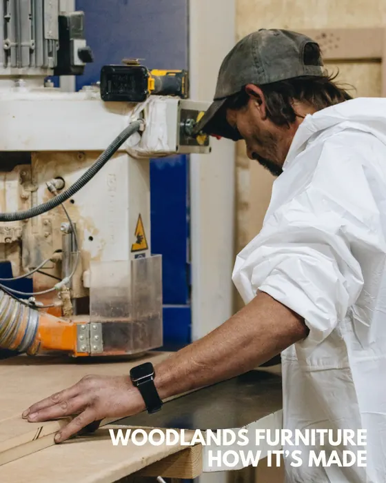 Woodlands Furniture craftsperson shaping timber in the English factory